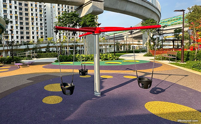 Tengah Garden District Common Green Playgrounds: Super Whimsical & Super Shoe 2 Super Whimsical Playground at the Tengah Garden District Common Green is a swing carousel