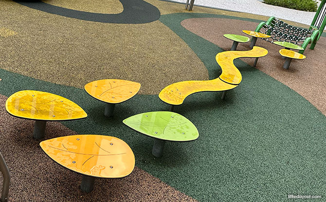 Woodgrove Ascent Playgrounds: 6 Forest-Themed Play Areas 7 A series of obstacles including low climbing discs, a climbing net and stepping stones